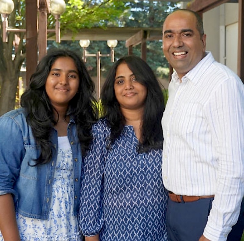 Lead Pastor Dr. Johnsy John with wife Sherin and daughter Abigail